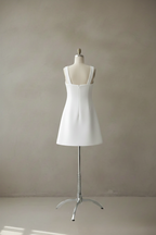 White dress back view on mannequin