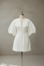 White puff sleeve dress on mannequin