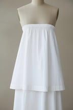 White tiered dress front close-up detail on mannequin