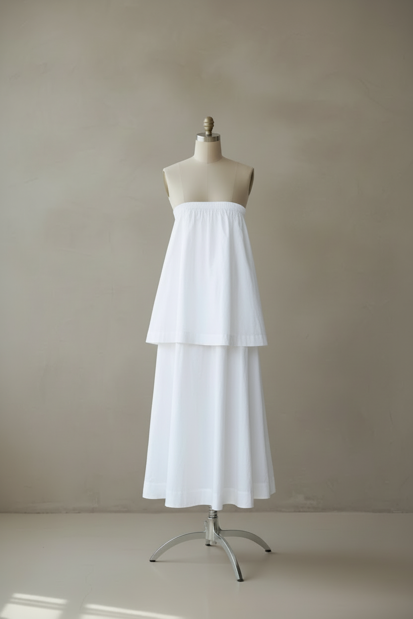 White tiered dress positioned higher on mannequin