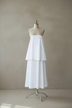 White tiered dress positioned higher on mannequin